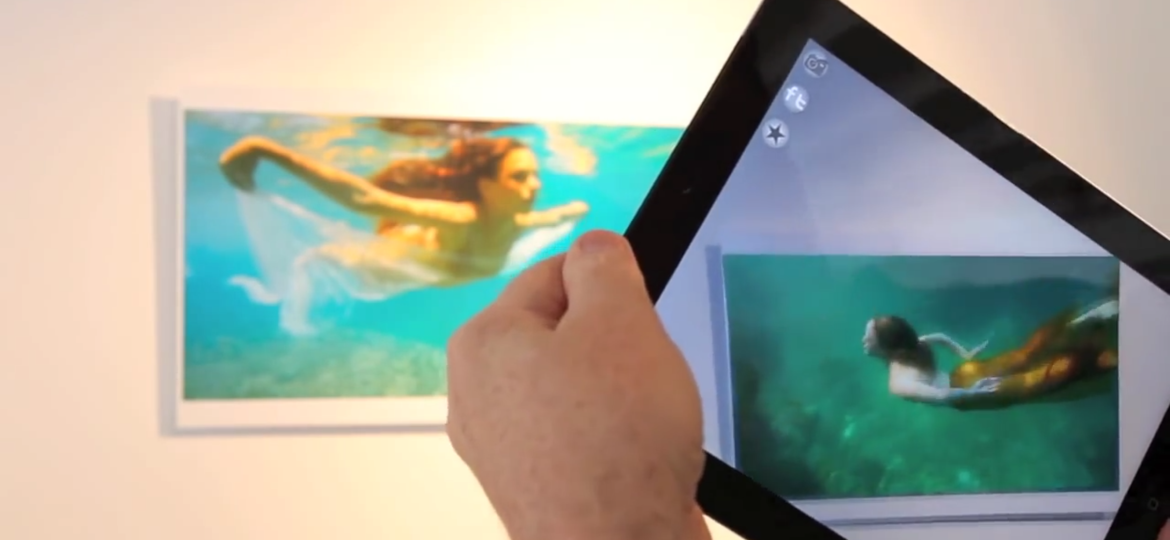 girl swimming photo turns into videon on AR tablet