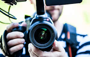 man holding camera front