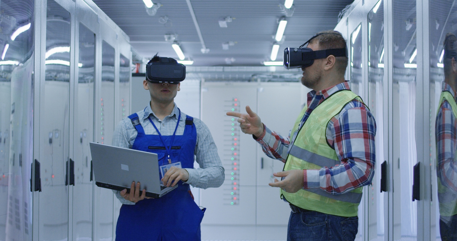 Men working in VR headset on plant